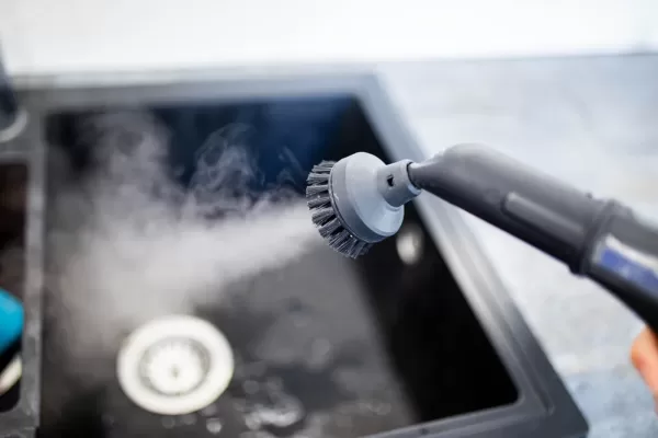 Cleaning,The,Sink,And,Faucet,With,A,Steam,Cleaner,,Disinfection Hospitality Cleaning Services -1